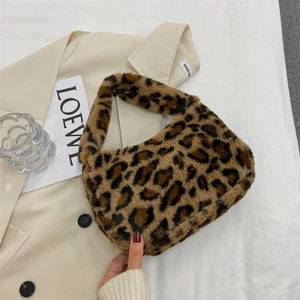 Stylish leopard print plush shoulder bag for women on beige blazer background