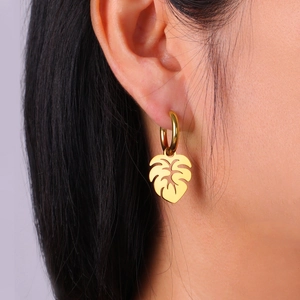 Bohemian 18K gold plated monstera leaf drop earrings on model for DIY jewelry styles