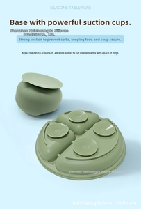 Detail of baby silicone tableware set featuring strong suction base on bowl and divided plate