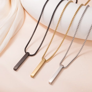 Three polished minimalist bar pendant necklaces in black, gold, and silver finishes