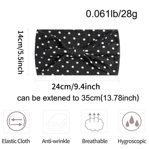 Detail view of black polka dot elastic headband showing weight and extended size dimensions