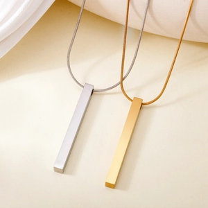 Detailed view of minimalist gold and silver rectangular bar pendants on sleek snake chains