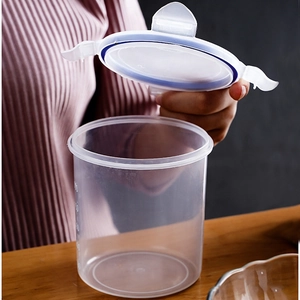 Transparent plastic food storage jar with white locking lid and measurement scales