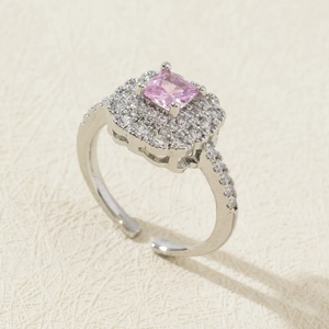 Detailed view of adjustable ring with square pink zircon and silver pavé setting