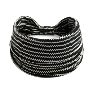 Detail of wide elastic headband with black and white zigzag knitted wavy pattern