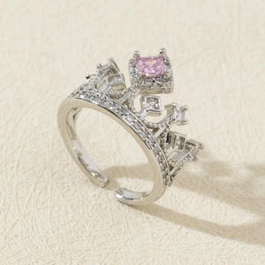 Detail of silver crown ring featuring a pink square zircon and micro-pave setting