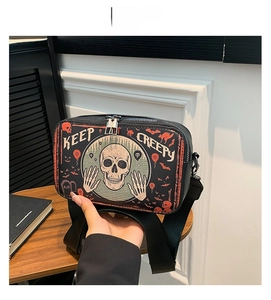 Detail of the Keep Creepy Halloween crossbody bag with skull and bat illustration