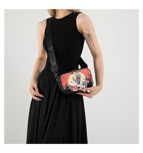 Detail of Halloween crossbody bag with spooky prints and adjustable nylon shoulder strap