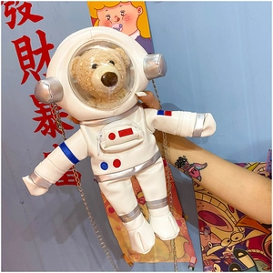 Close-up of cute astronaut bear bag with white faux leather and clear dome helmet detail