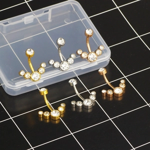 Set of 6 stainless steel belly rings with curved bars and five-stone zircon clusters