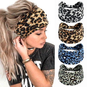 Detail of four leopard print wide elastic headbands and a model wearing the brown style