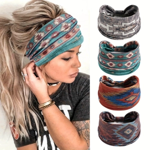 Detail of four bohemian elastic sports headbands with ethnic prints on soft knit fabric
