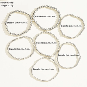 Detail showing 7-piece set of silver beaded elastic bracelets with size and weight info
