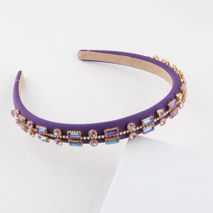 Elegant purple satin headband with sparkling rhinestones and golden metal settings