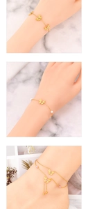 Detail of butterfly bracelets and anklet with pearls and pink zircon accents