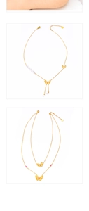 Detail of gold butterfly necklace with pink gems, faux pearls and adjustable lobster clasp