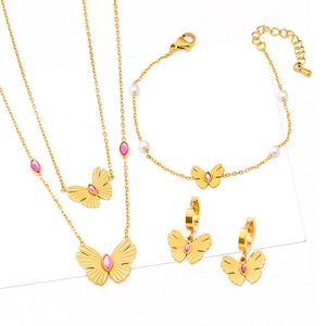 Golden butterfly jewelry set with pink stones and pearls including necklaces and earrings