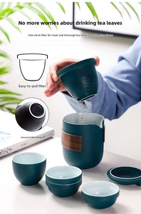 Detail of ceramic travel tea set showing a fine mesh filter and heat-resistant wooden ring