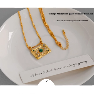 Macro detail of vintage square evil eye necklace with green malachite and 18K gold plating