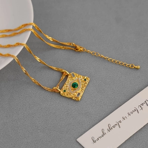 Vintage evil eye rectangular pendant necklace with green stone on gold twisted chain