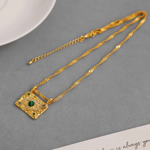 Retro gold Evil Eye pendant necklace with green malachite stone and zircon on ripple chain