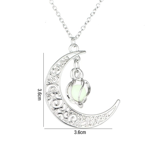 Detailed view of hollow moon pendant with luminous green bead and 3.6cm size measurement