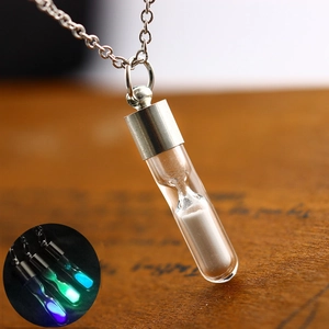 Luminous hourglass necklace with glowing sand pendant in silver finish jewelry