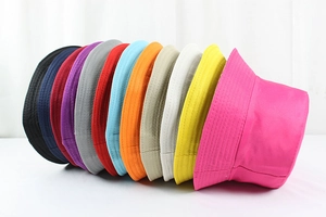 Detailed display of colorful polyester bucket hats in various vibrant solid color options