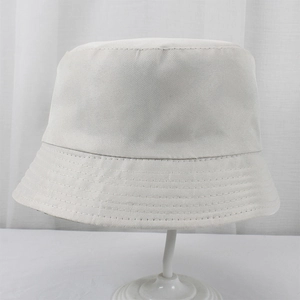 Detail of white polyester bucket hat with reinforced multi-row brim stitching for stability