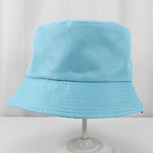 Detail of light blue polyester bucket hat showing twill fabric texture and parallel stitching