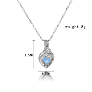 Detailed view of luminous heart pendant necklace with dimensions and blue core detail