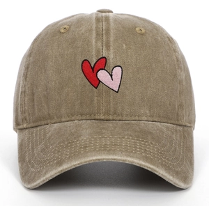 Close-up of interlocking red heart embroidery on washed cotton vintage baseball cap