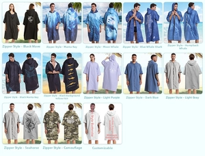 Detail of hooded beach towel ponchos with zippers in various ocean patterns and colors