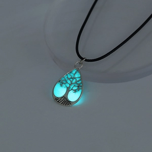 Luminous tree of life necklace glowing in cyan light with a black braided cord detail