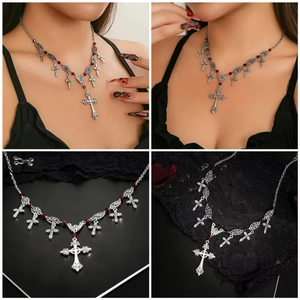 Detailed macro view of vintage Gothic silver cross necklace with dark red beads