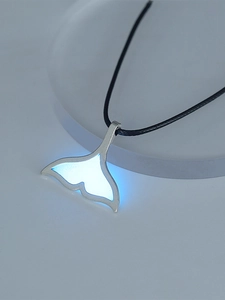 Detailed view of luminous blue whale tail pendant with black rope chain for women