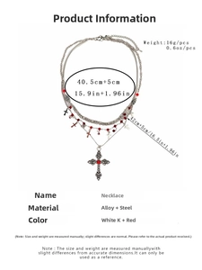 Gothic layered necklace details showing cross pendants and red beads on silver chains