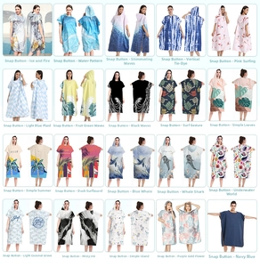 Grid display of quick-dry hooded beach ponchos in twenty diverse vibrant patterns