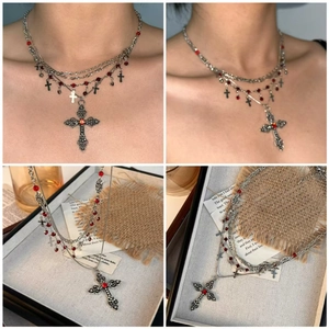 Gothic layered silver cross necklace featuring red beads and vintage style pendant detail
