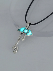 Close-up of luminous eye-shaped pendant with blue glow and black leather cord