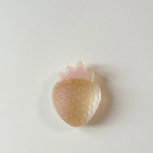 Detail of strawberry-shaped resin phone grip with colorful iridescent gradient finish