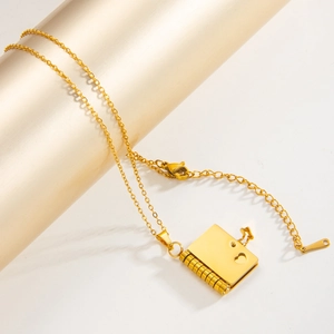Golden heart book locket necklace in stainless steel with spiral binding detail