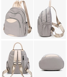 Grey Oxford cloth backpack for women featuring contrast straps and large capacity for travel