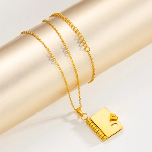Gold book-shaped pendant necklace with heart detail and adjustable link chain for women