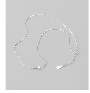 Detailed view of S925 sterling silver snake chain necklace with a single round bead charm