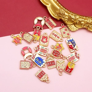 Close-up of Chinese style alloy enamel charms with lucky words for DIY jewelry