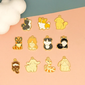 Detailed view of various cute animal enamel charms for DIY jewelry and keychains.