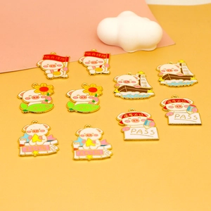 Close-up of cute cartoon pig enamel charms for DIY jewelry and lucky student exam gifts.