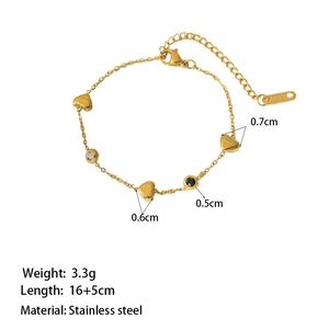Gold stainless steel heart bracelet with round black and white stones and lobster clasp