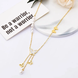 Golden Y-shaped necklace with white shell butterfly pendant and long pearl tassels